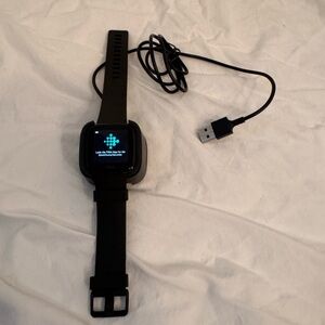 Fitbit Black Smartwatch with Sleek Design and USB Charging